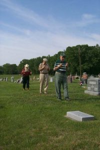 divine 3 men in cemetery with divining rods
