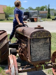 woman on old tractor