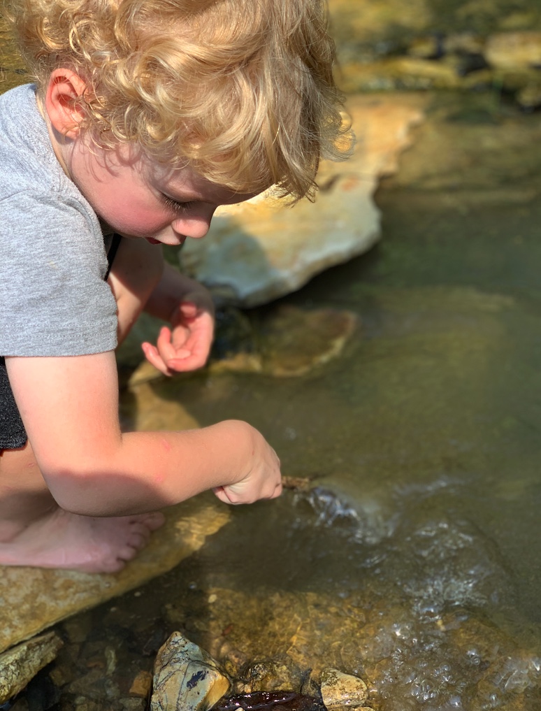 Little boy at creek