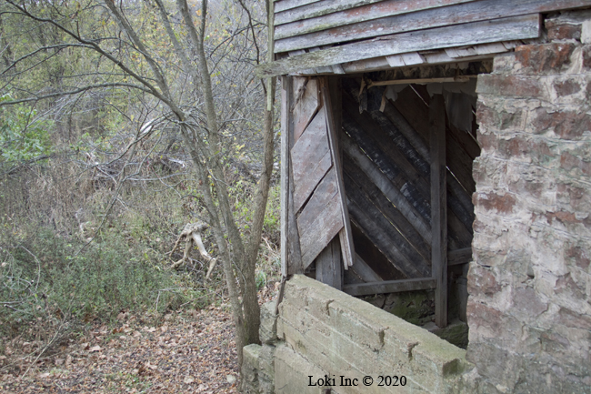 Northwest corner siding and concrete of Hammond Mill