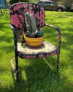 Metal chair with fake succulents