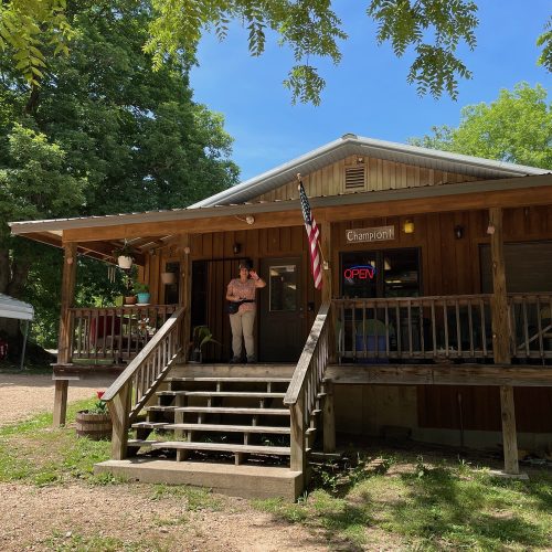 woman on Henson store porch