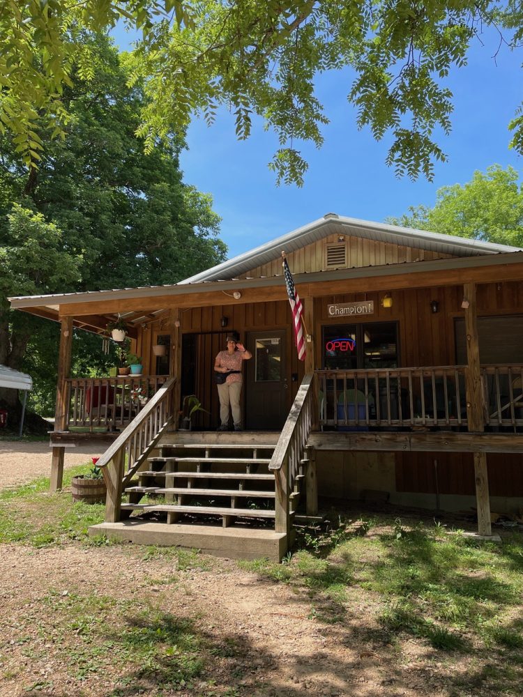 woman on Henson store porch