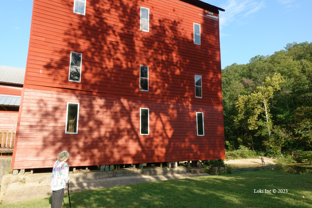 Rita Fancher beside Rockbridge Mill