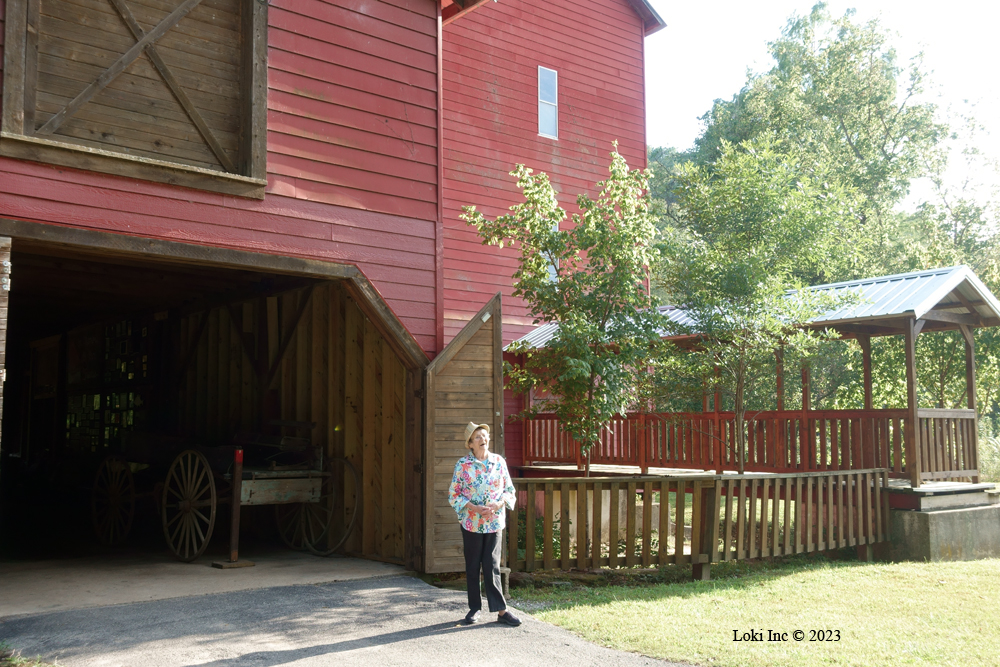 Rita Fancher in front of Rockbridge Mill