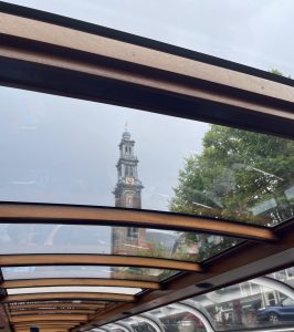 canal view of West Church in Amsterdam